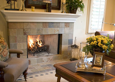 Square stoned hearth with a wood burning fire