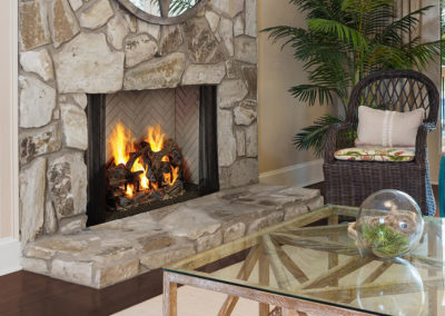 White stone colored hearth with wood burning
