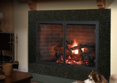 Wood burning in a fire place with brick