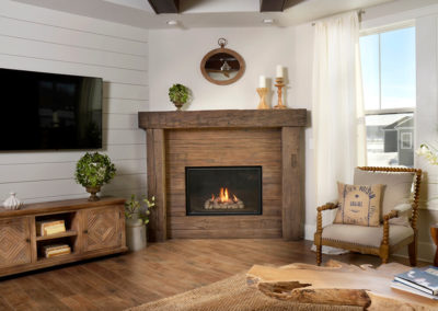 Wooden paneled fireplace in a white room