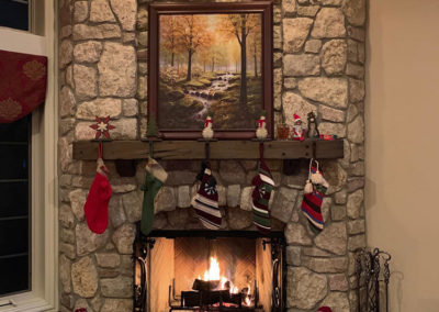 Large stone fireplace with christmas decor
