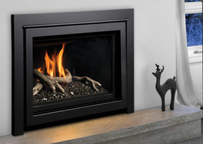 Black electric fireplace in against a white wall