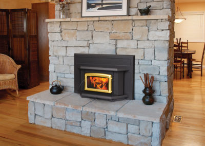 Stone hearth with a wood burning fireplace insert